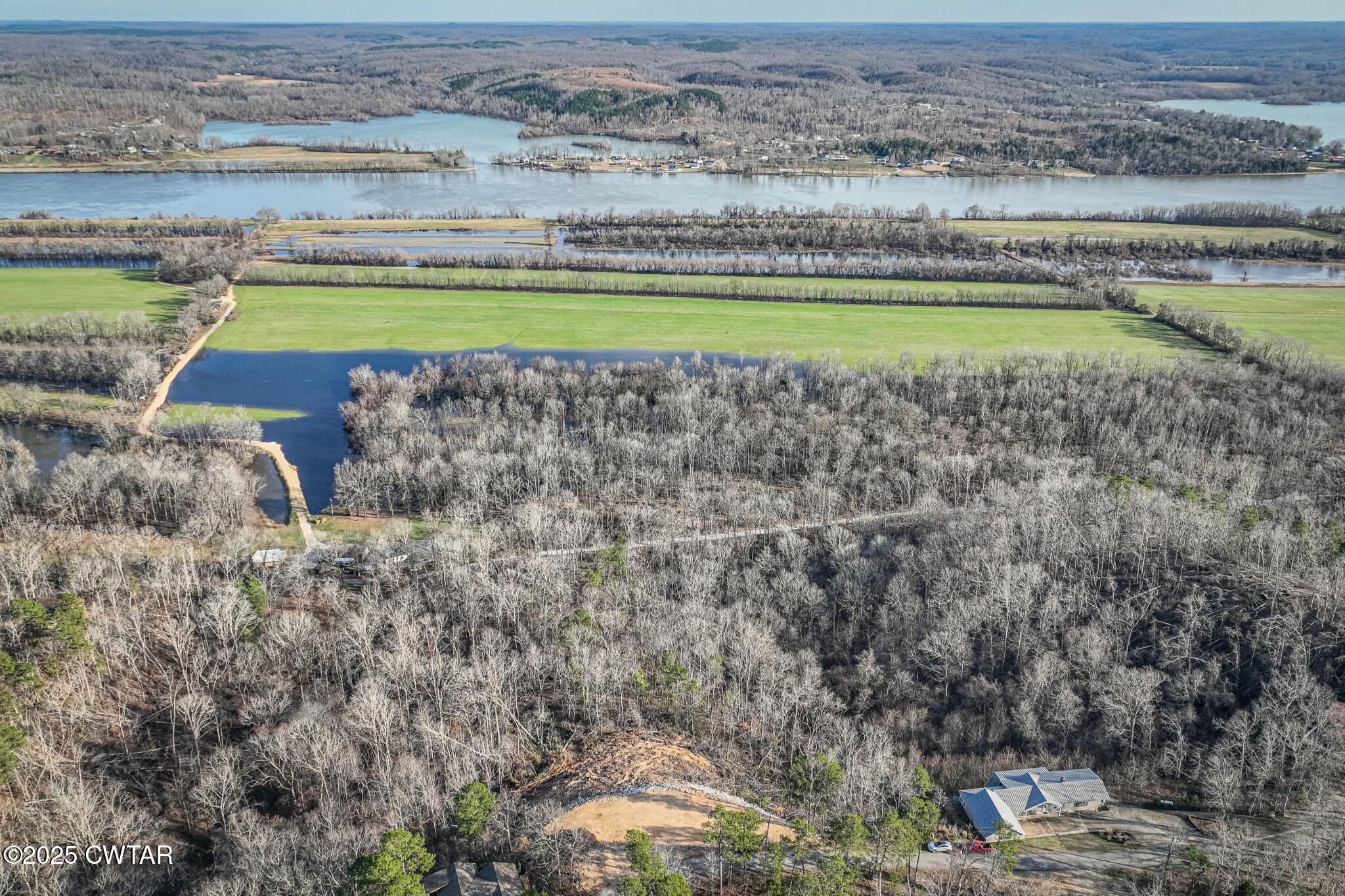 a view of a swimming pool and a yard