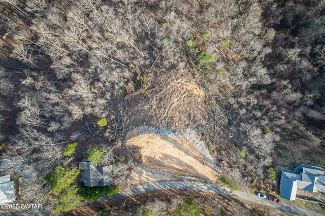 an aerial view of a city and lake view