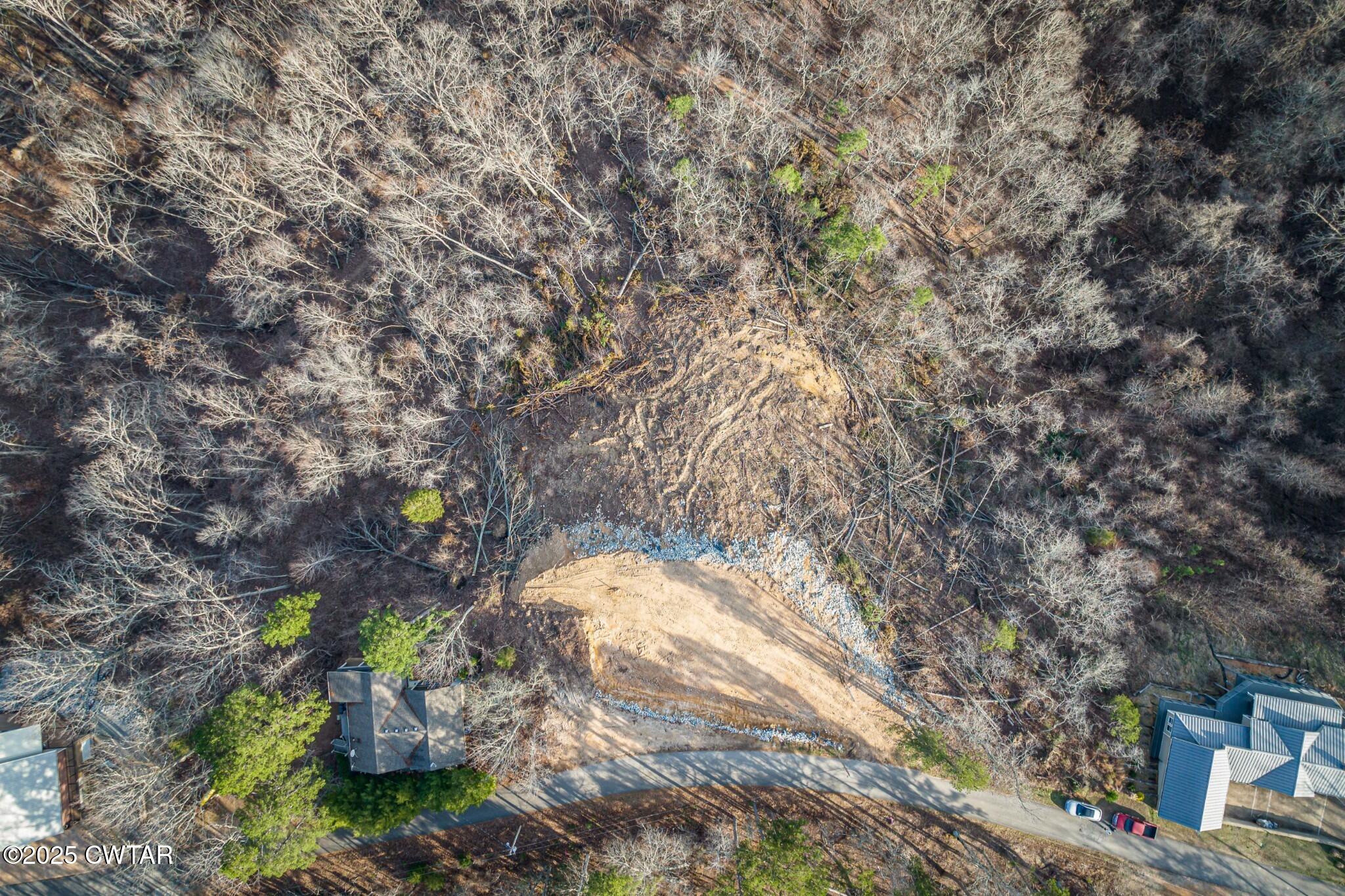 49-50 Ridgeway Drive Sugar Tree, TN 38380 - Photo 18 of 29 a backyard of a house with a yard and outdoor seating
