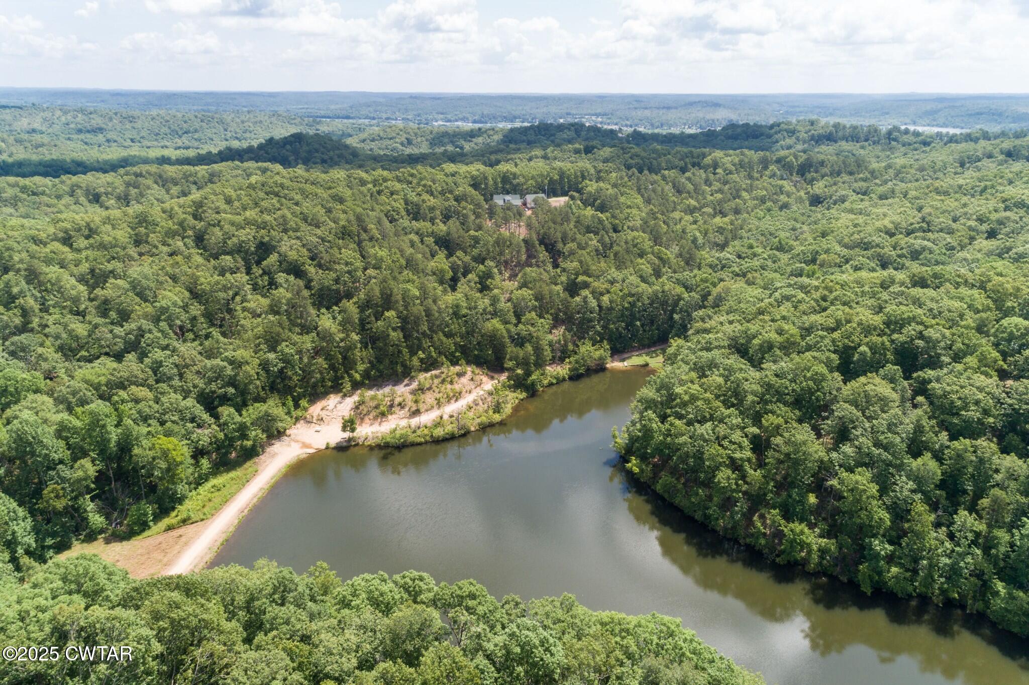 49-50 Ridgeway Drive Sugar Tree, TN 38380 - Photo 21 of 29 a view of a lake with a yard