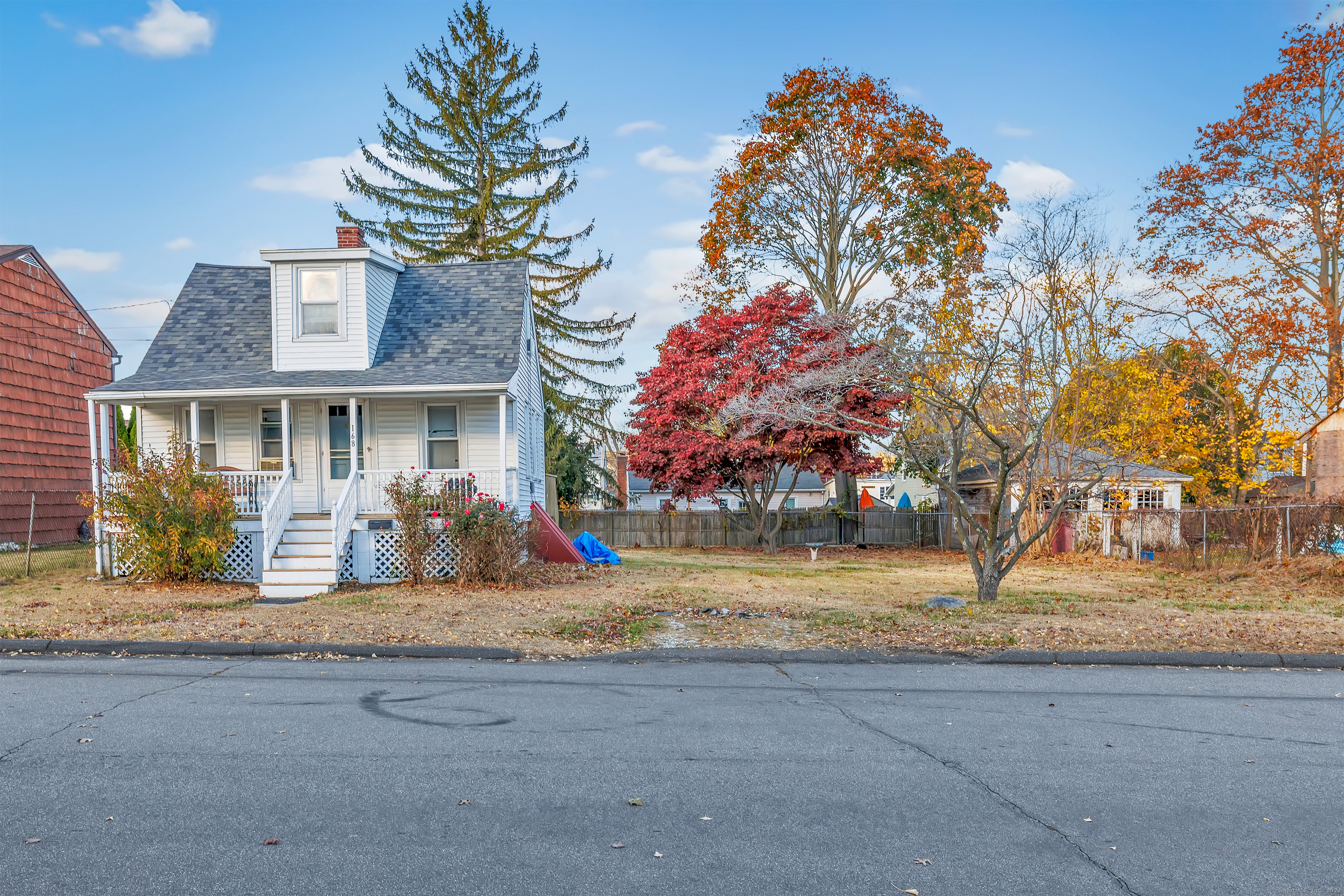 168 Ridgely Avenue Fairfield, CT 06825 - Photo 1 of 1 a view of a house with a large tree