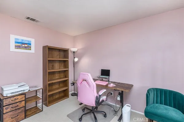 a view of a workspace with furniture