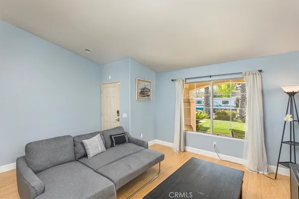 a living room with furniture and a large window