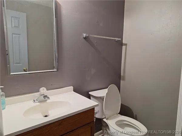 a view of a yard with large trees