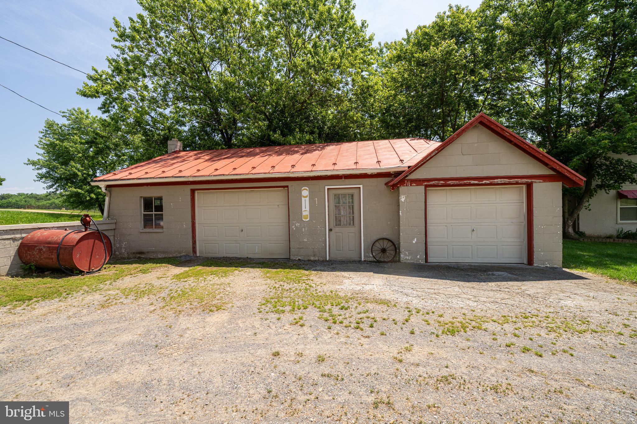 3637 Millwood Road Boyce, VA 22620 - Photo 26 of 62 a front view of a house with a garden and yard