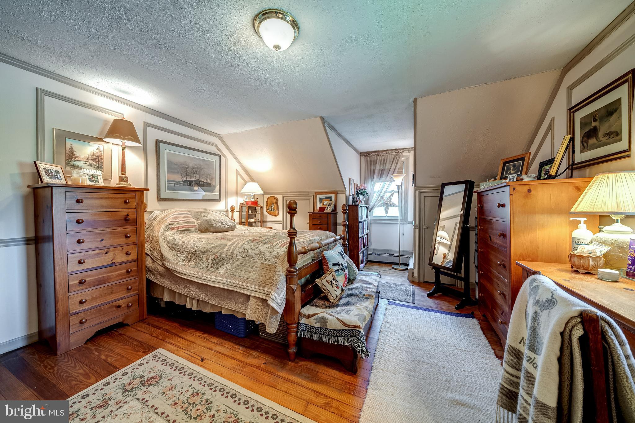 3637 Millwood Road Boyce, VA 22620 - Photo 48 of 62 a bedroom with a bed and furniture