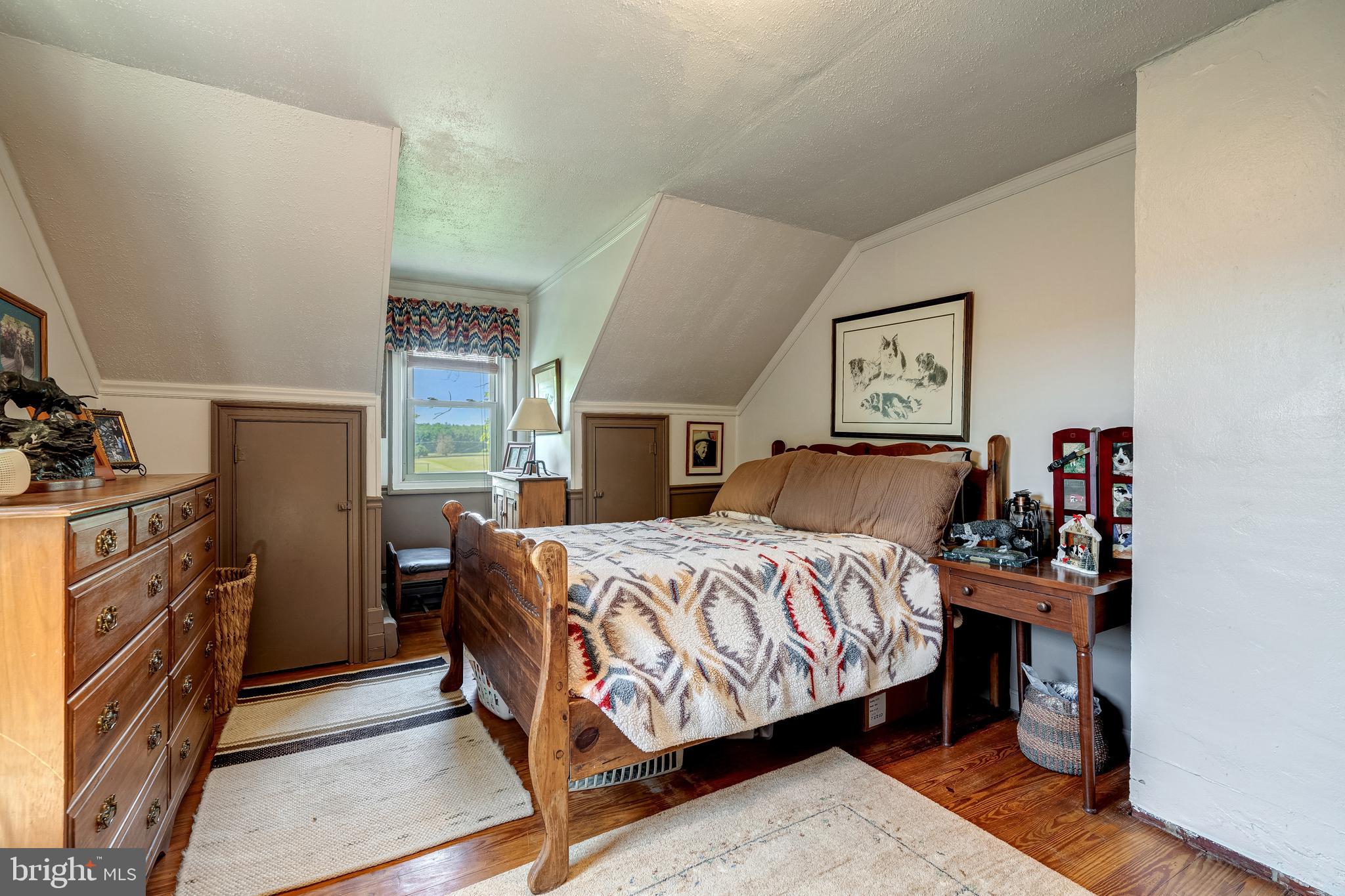 3637 Millwood Road Boyce, VA 22620 - Photo 50 of 62 a bedroom with a bed and a tv on the dresser