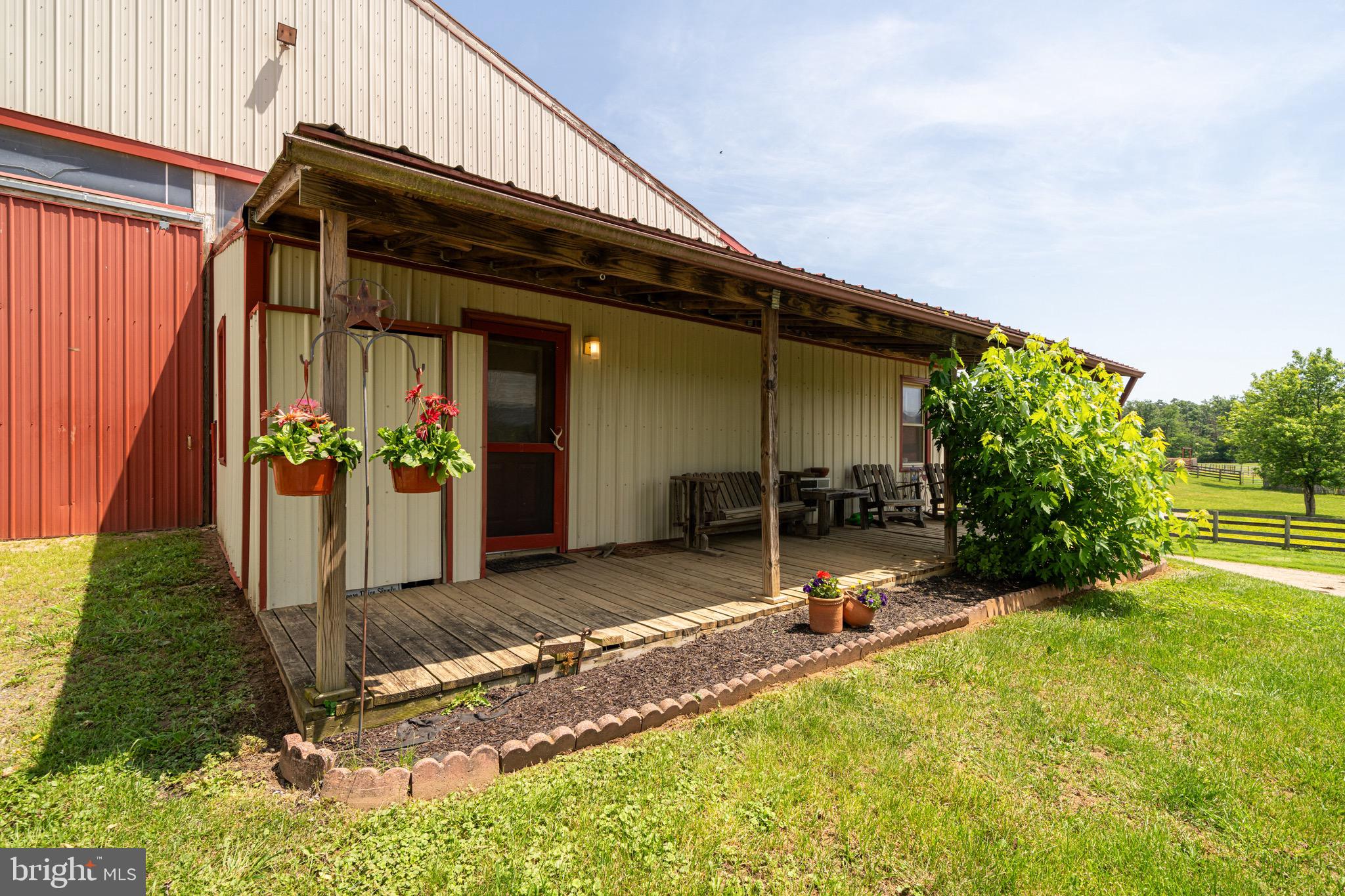 3637 Millwood Road Boyce, VA 22620 - Photo 51 of 62 a backyard of a house with yard and outdoor seating