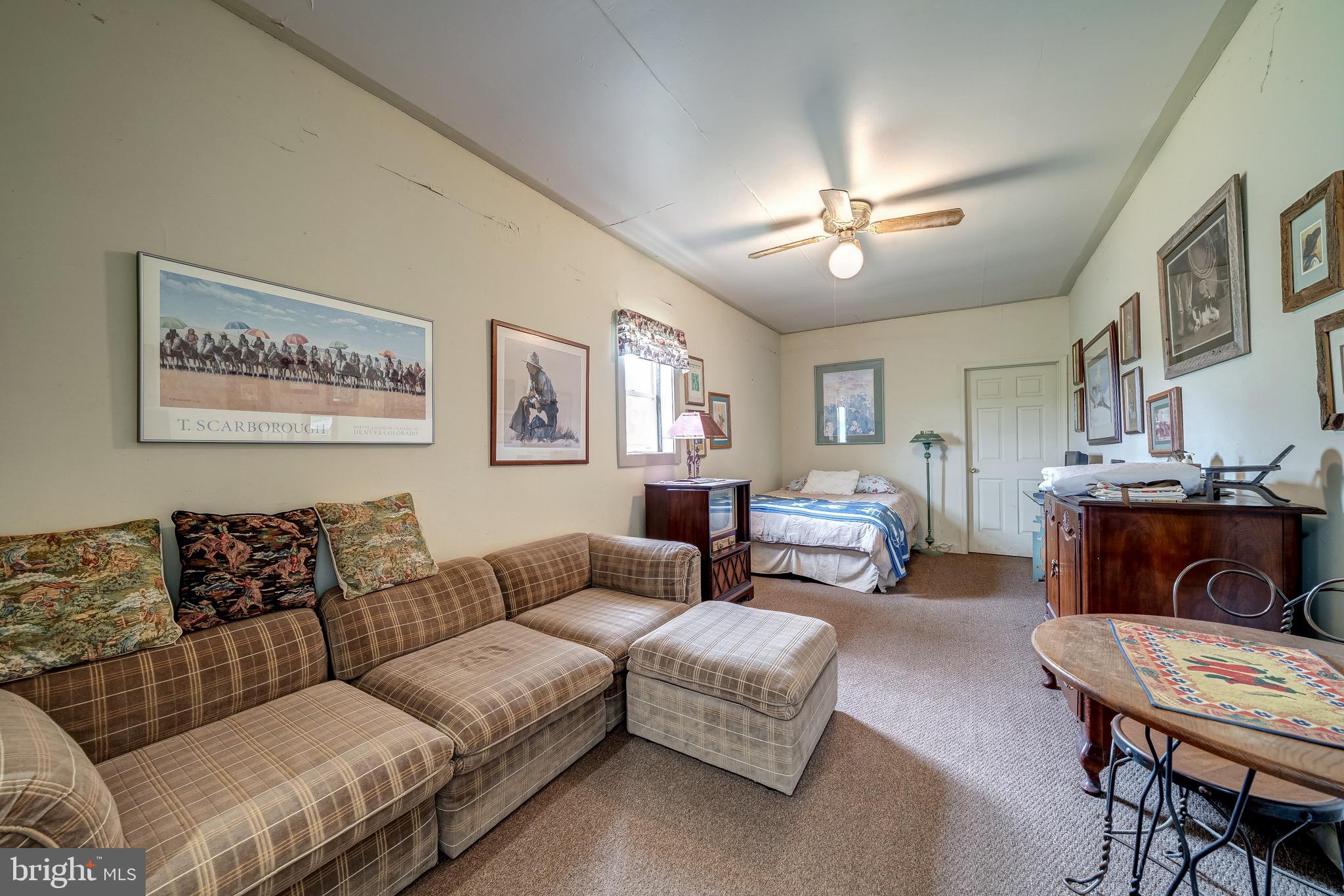 3637 Millwood Road Boyce, VA 22620 - Photo 57 of 62 a living room with furniture and a chandelier
