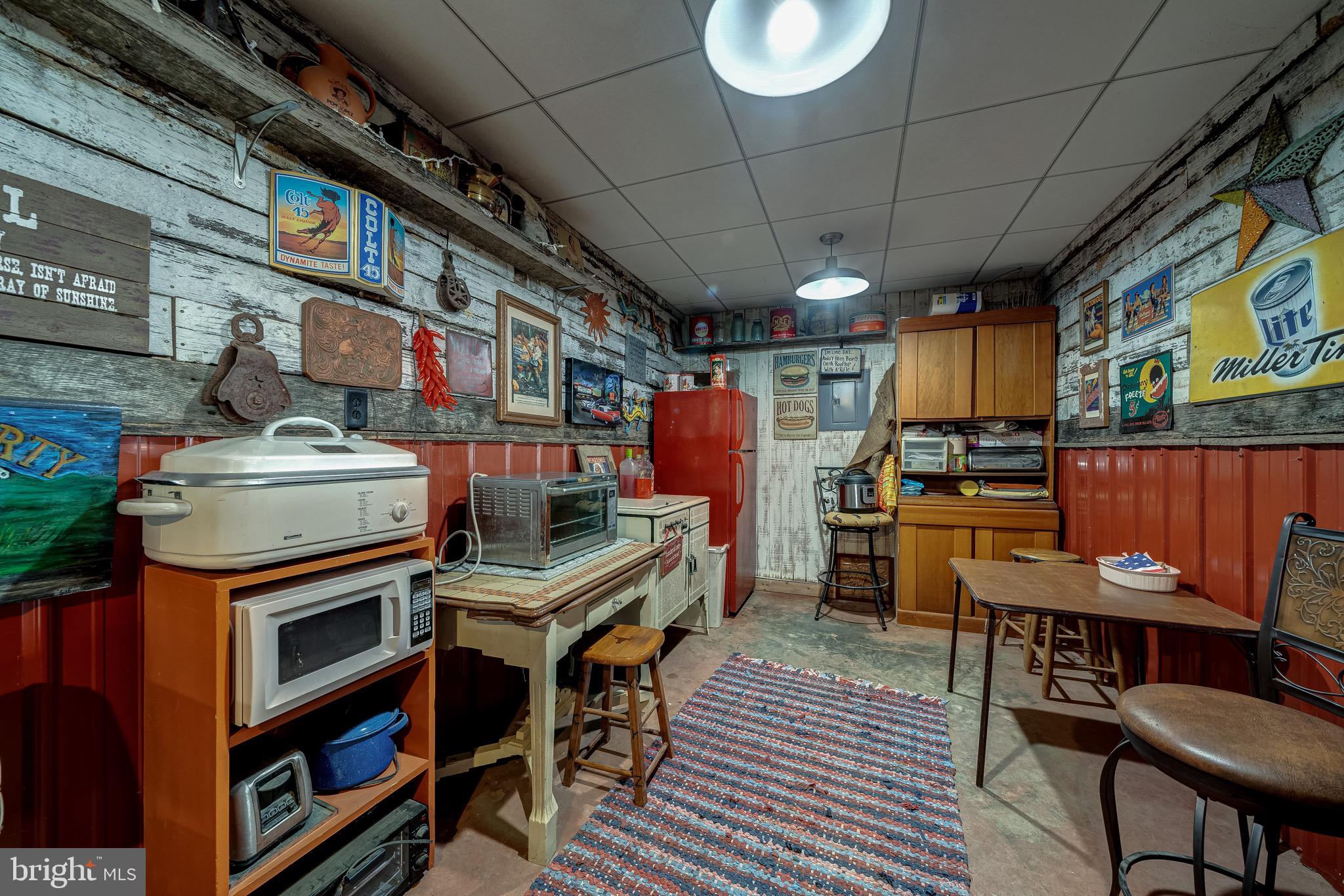 3637 Millwood Road Boyce, VA 22620 - Photo 62 of 62 a kitchen with stainless steel appliances a stove a refrigerator and a dining table