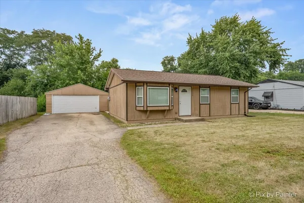 two house with trees in front of it