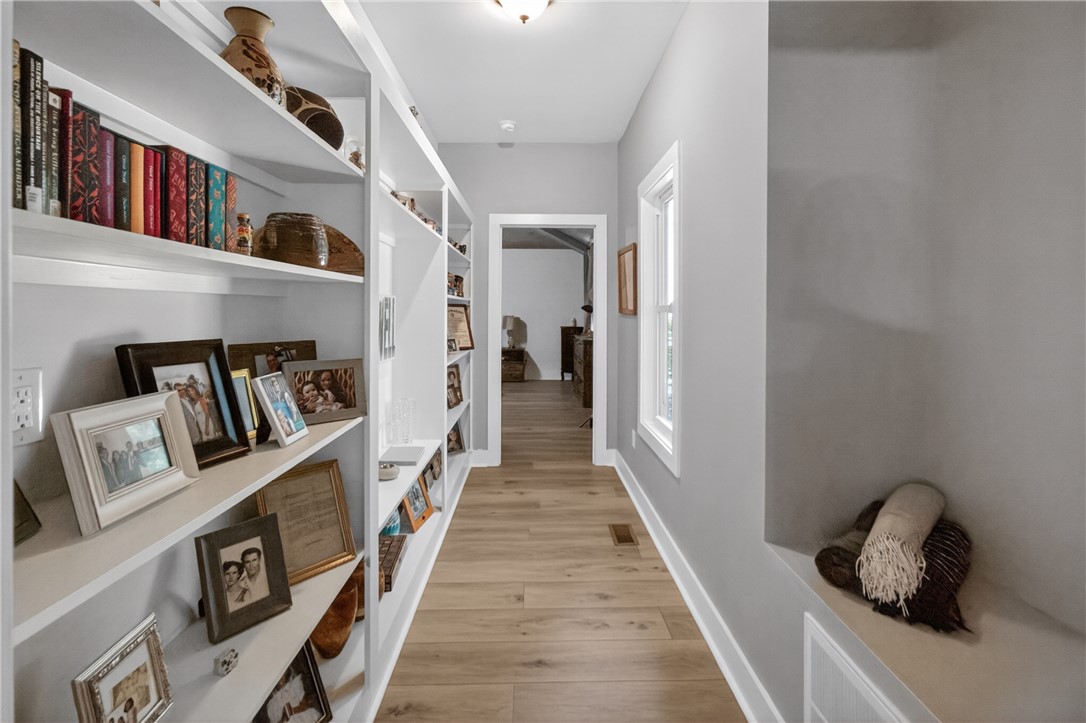1504 Double Springs Road Townville, SC 29689 - Photo 10 of 41 This bright hallway showcases built-in features and elegant hardwood flooring, leading to another inviting space.
