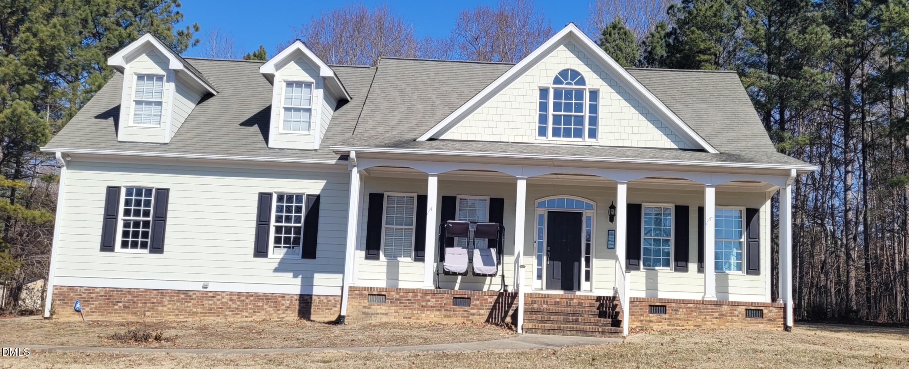 226 Fletcher Ridge Road Timberlake, NC 27583 - Photo 1 of 30 a front view of a house with glass windows