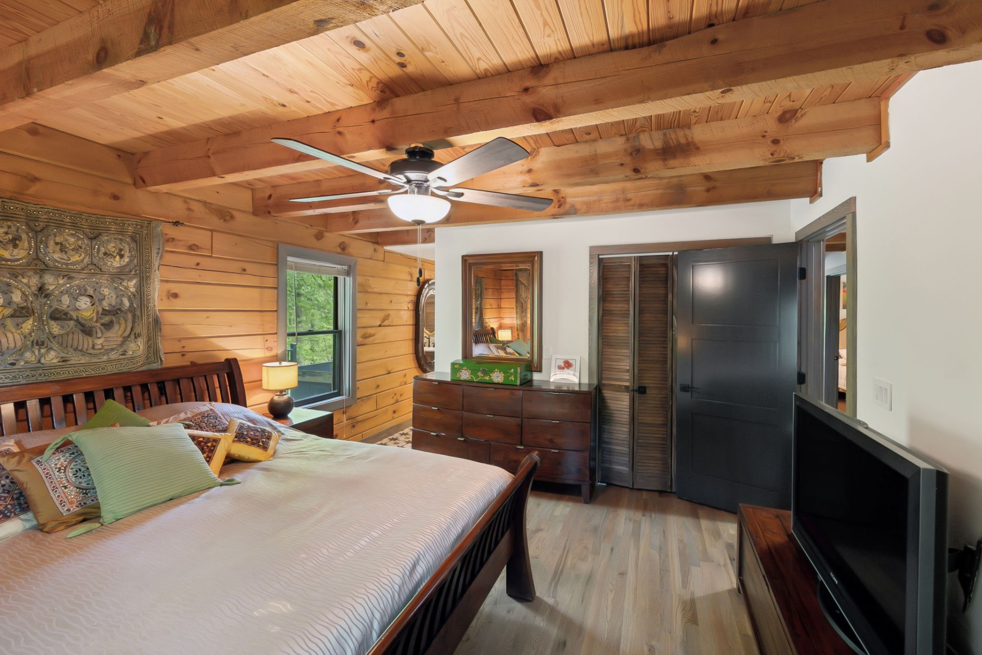 5617 A Pinewood Road Franklin, TN 37064 - Photo 29 of 67 a bedroom with a bed and a chandelier