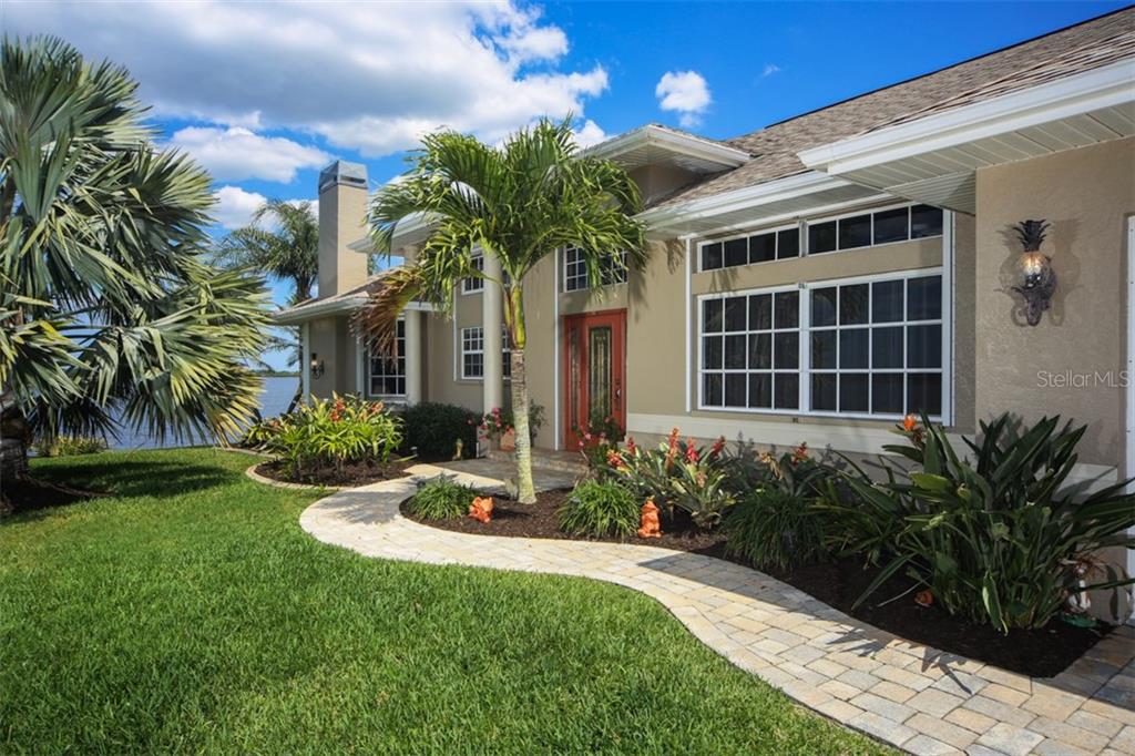 2344 Risken Terrace Port Charlotte, FL 33981 - Photo 1 of 1 Front ~ Volume Ceilings & Pavers