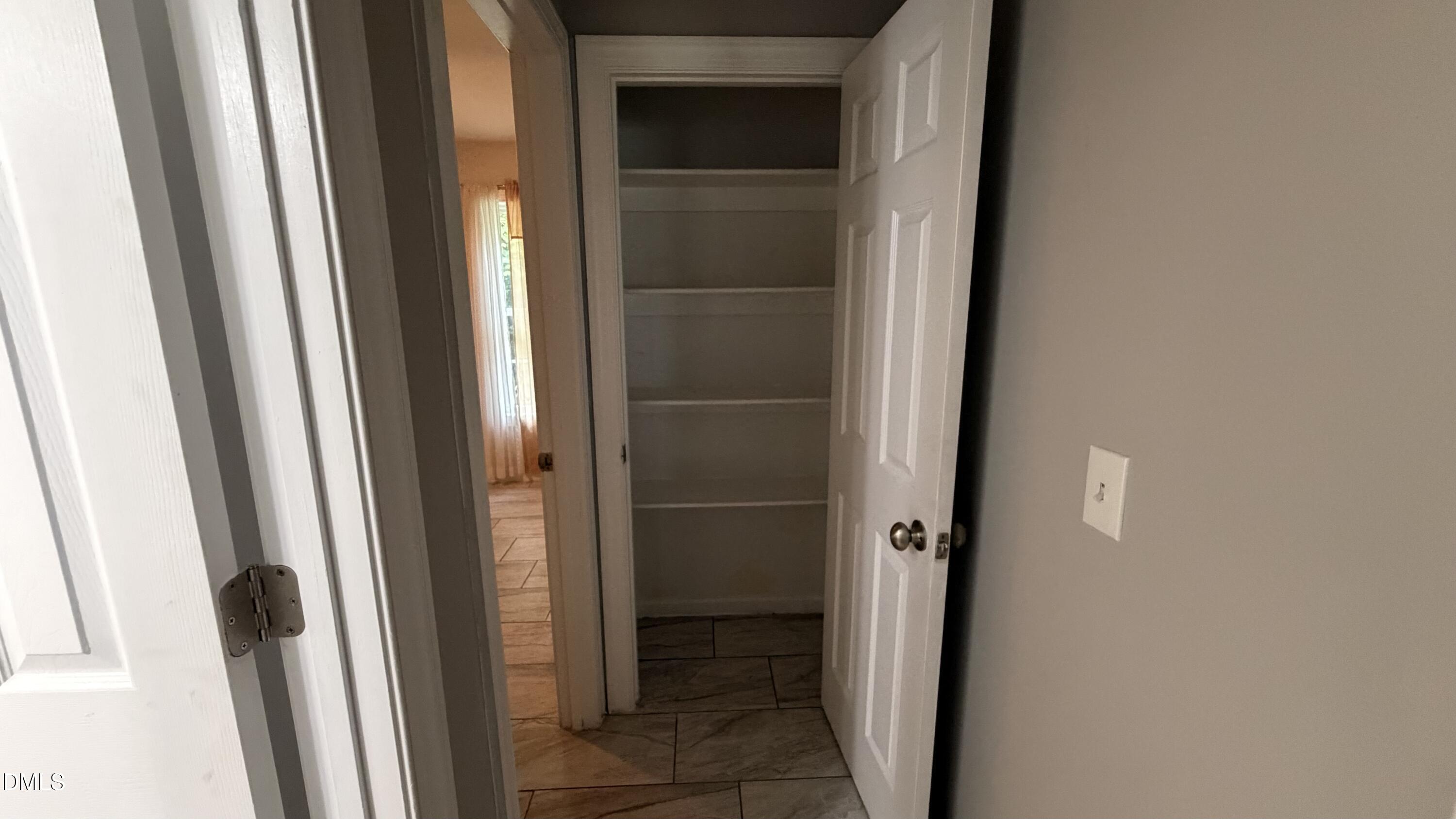 229 Sterling Way Angier, NC 27501 - Photo 5 of 10 a bathroom with a glass door