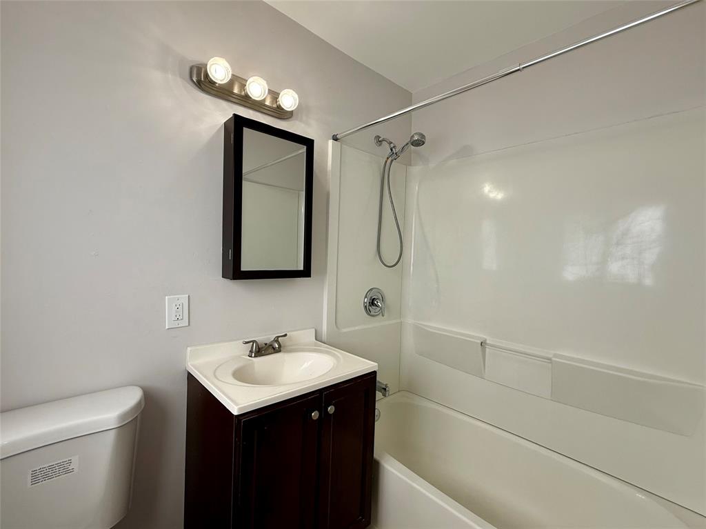 2210 Northeast 54th Street, Unit W Fort Lauderdale, FL 33308 - Photo 13 of 21 a bathroom with a sink toilet and shower
