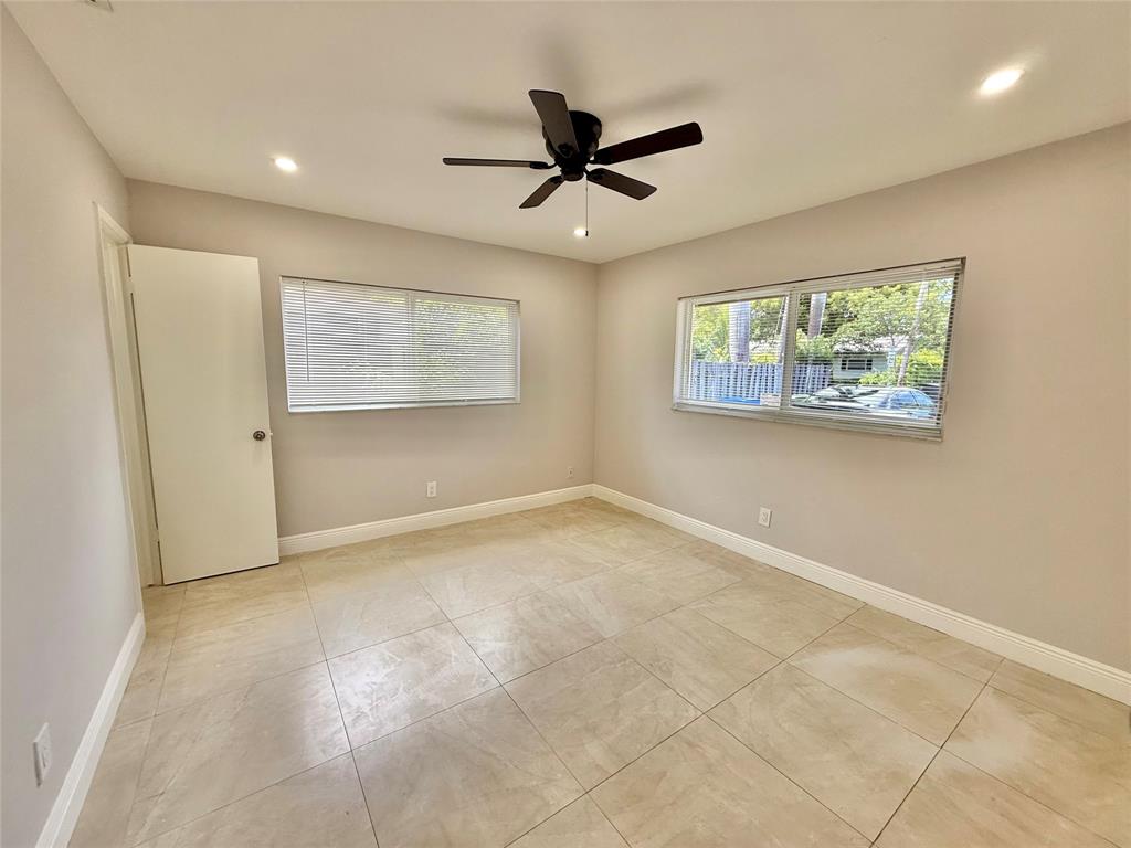 2210 Northeast 54th Street, Unit W Fort Lauderdale, FL 33308 - Photo 14 of 21 a view of an empty room with a window