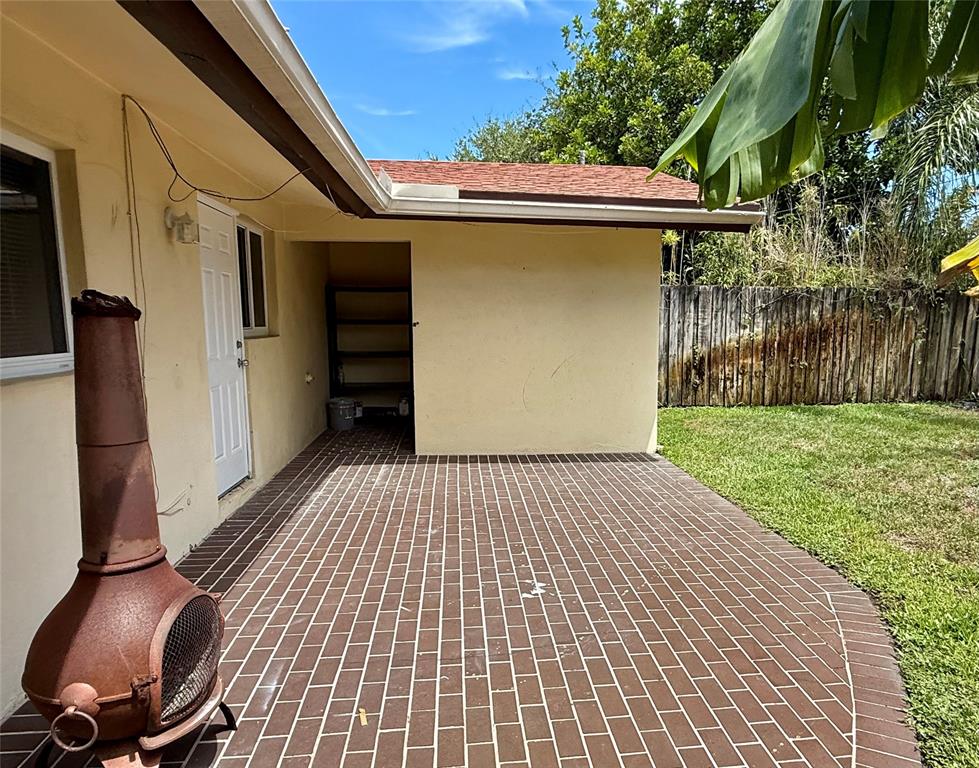 2210 Northeast 54th Street, Unit W Fort Lauderdale, FL 33308 - Photo 17 of 21 a backyard of a house