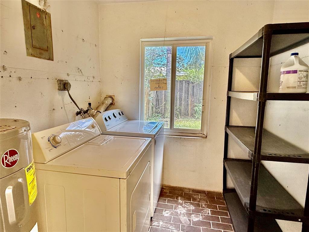 2210 Northeast 54th Street, Unit W Fort Lauderdale, FL 33308 - Photo 21 of 21 a bathroom with a sink and a window