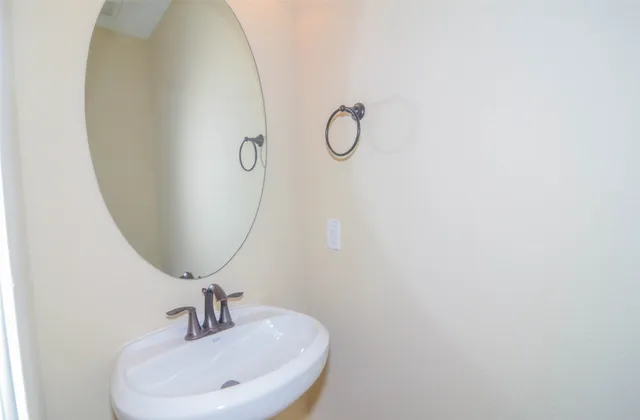 a bathroom with a sink and mirror