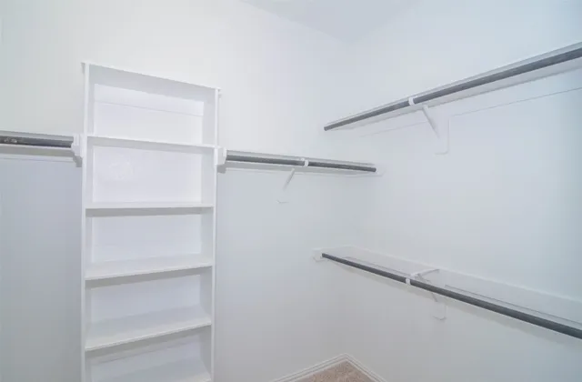 a view of an empty walk in closet