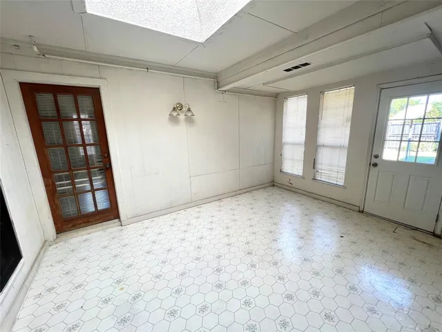 an empty room with windows