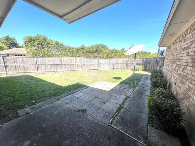 a view of a backyard with a area