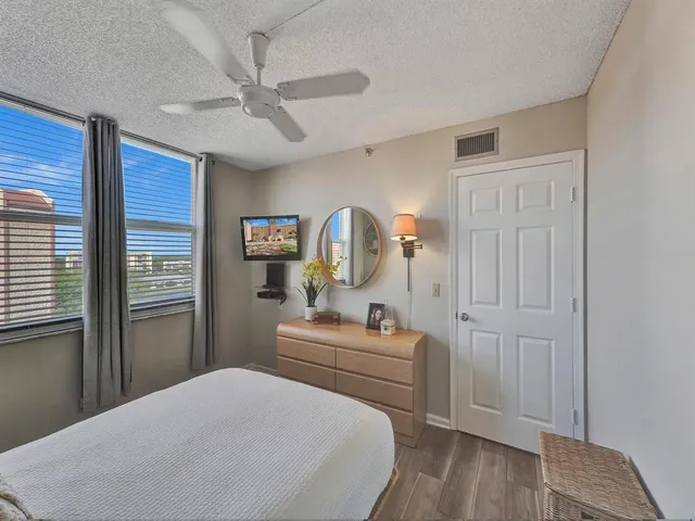 a bed room with a bed and dresser