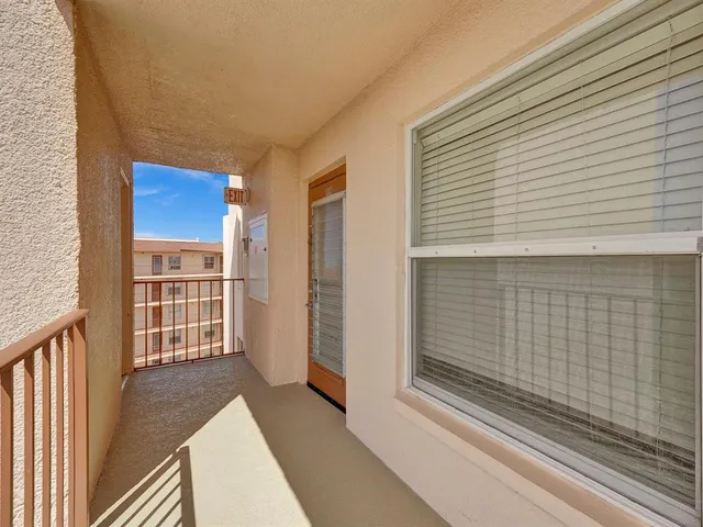 a view of balcony with furniture