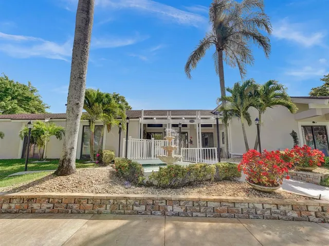 a swimming pool with outdoor seating and yard