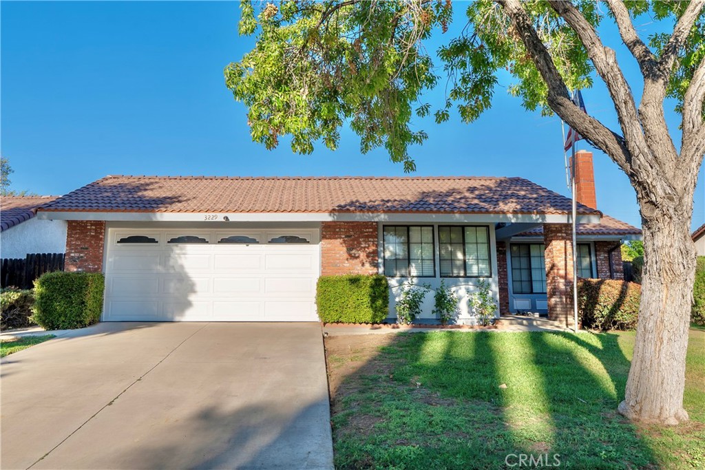 3229 Toro Way Riverside, CA 92503 - Photo 1 of 1 a view of a house with a yard and garage