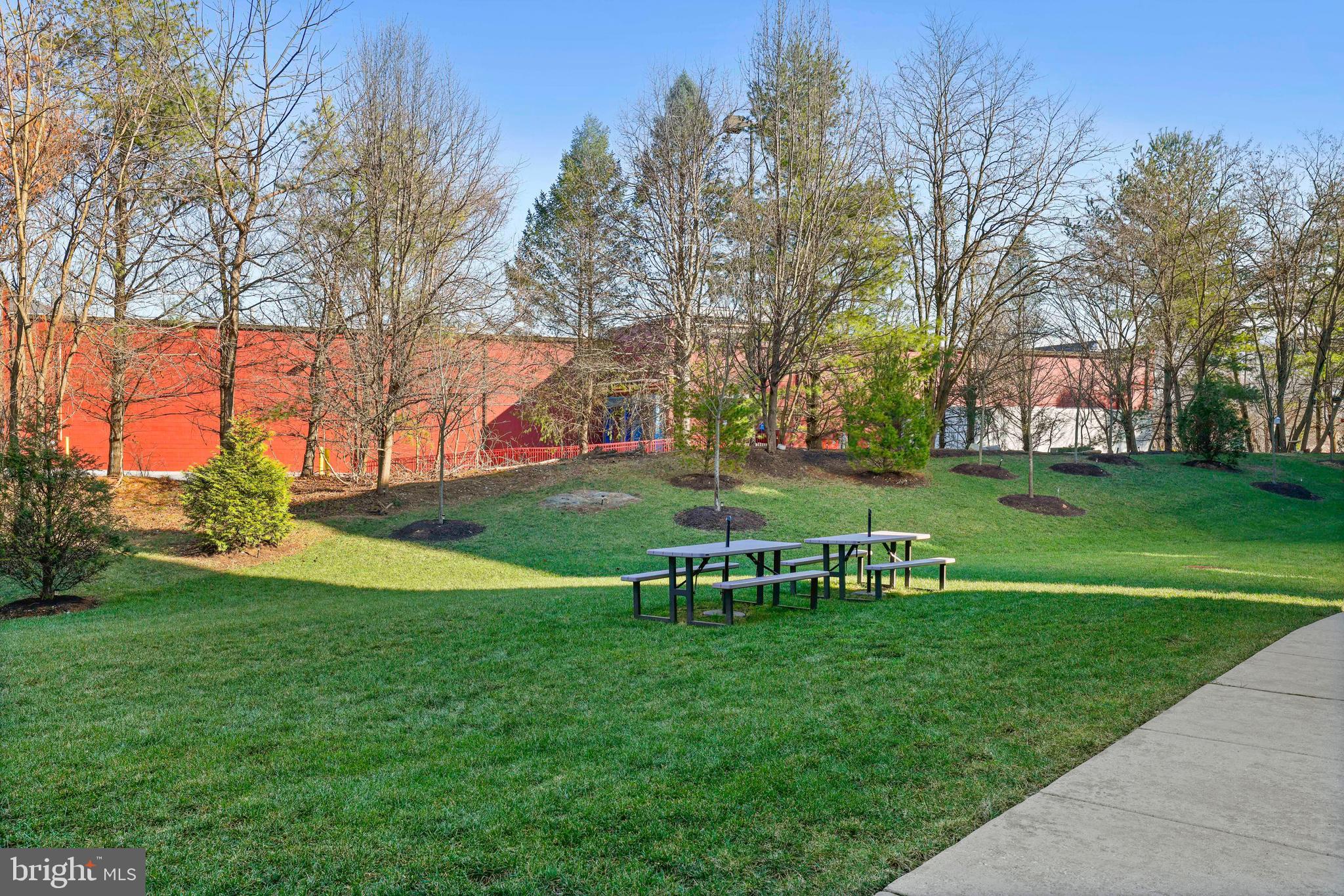 8380 Ice Crystal Drive, Unit R Laurel, MD 20723 - Photo 36 of 47 Benches and grills directly in rear of building.