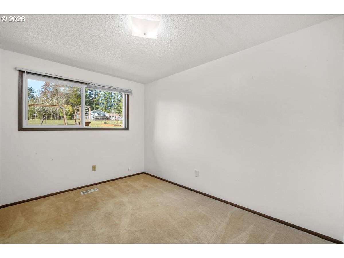 2035 Primrose Loop Philomath, OR 97370 - Photo 45 of 48 a view of an empty room with a window