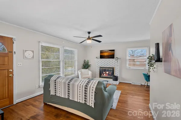 a living room with furniture and a fireplace