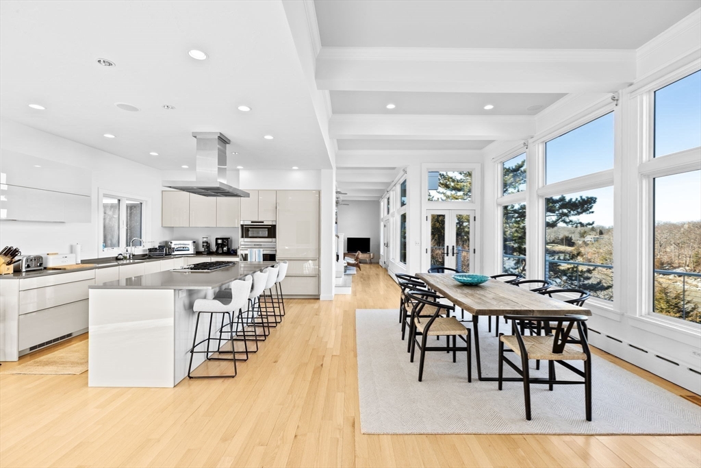 68 Nichols Road Cohasset, MA 02025 - Photo 13 of 41 a view of a dining room and livingroom with furniture wooden floor and a view