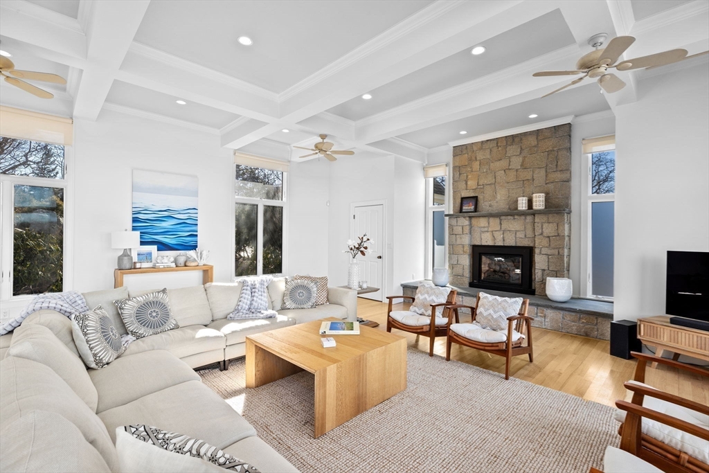 68 Nichols Road Cohasset, MA 02025 - Photo 14 of 41 a living room with furniture a fireplace and a flat screen tv