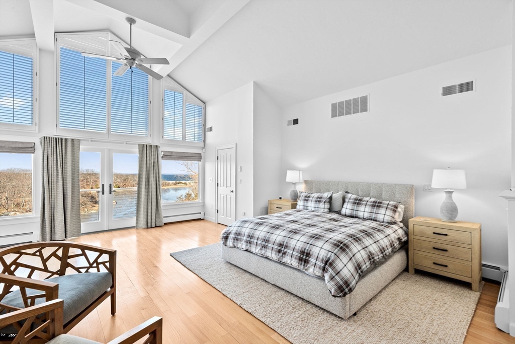 68 Nichols Road Cohasset, MA 02025 - Photo 19 of 41 a bedroom with a bed and wooden floor