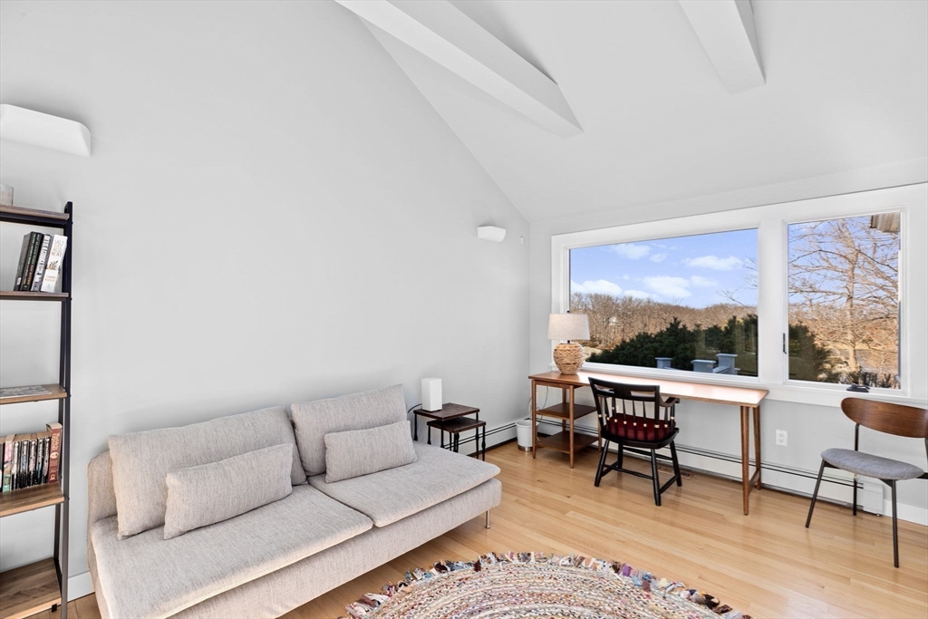 68 Nichols Road Cohasset, MA 02025 - Photo 22 of 41 a living room with furniture a rug potted plant and a large window