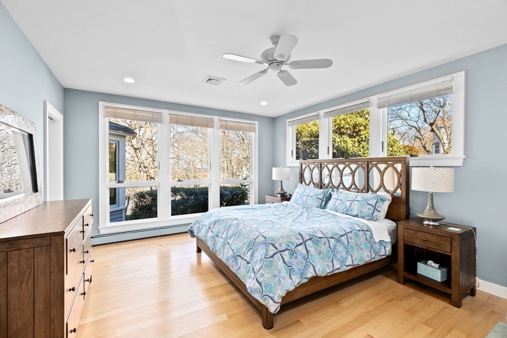 68 Nichols Road Cohasset, MA 02025 - Photo 25 of 41 a bedroom with a large bed and a chandelier