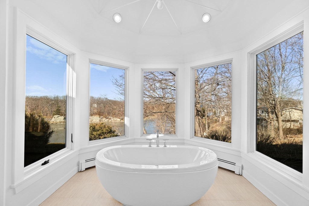 68 Nichols Road Cohasset, MA 02025 - Photo 27 of 41 a white bath tub sitting in a spacious bedroom next to a window