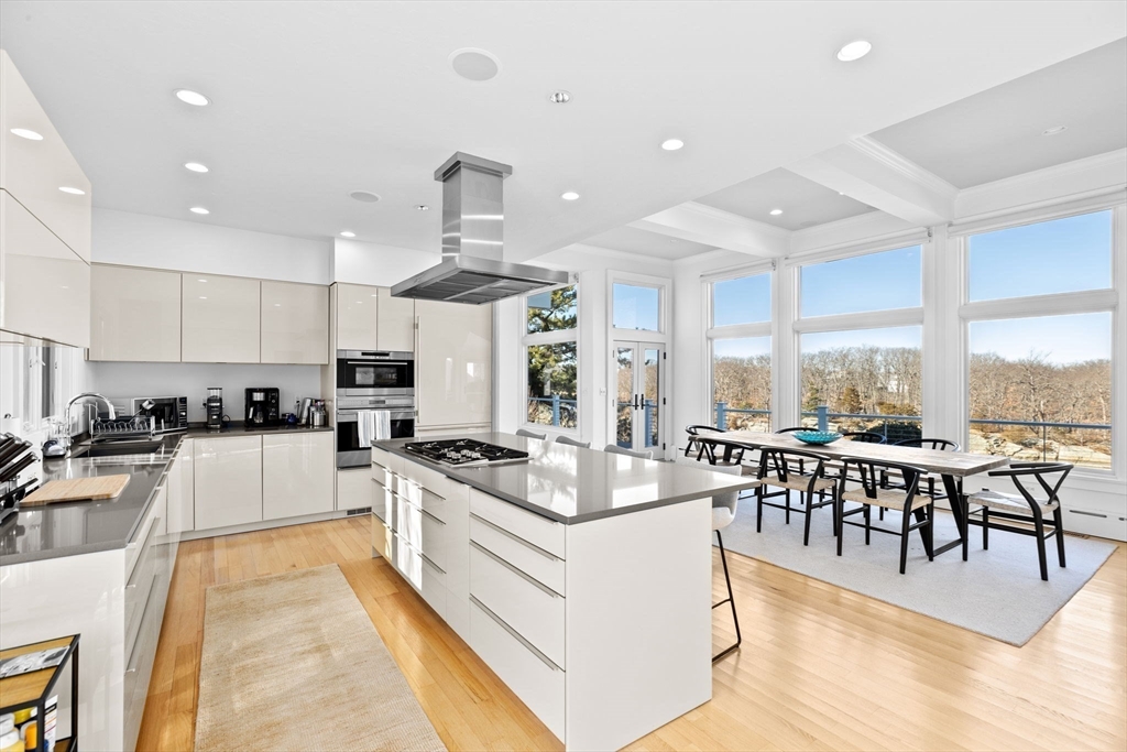 68 Nichols Road Cohasset, MA 02025 - Photo 3 of 41 a large white kitchen with lots of counter space a sink appliances and a large window