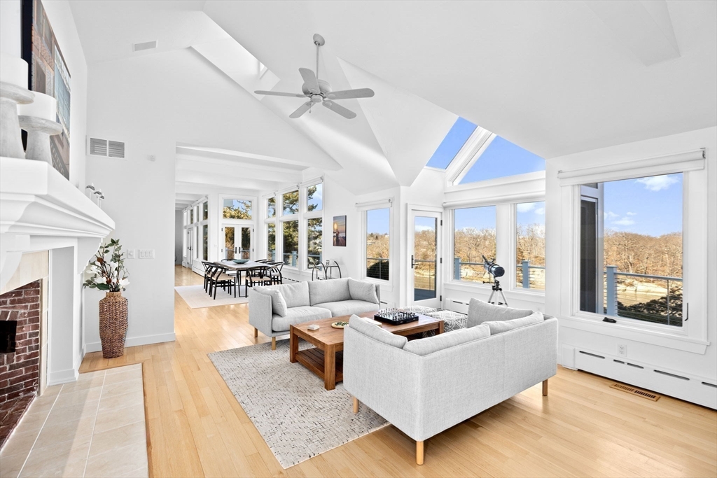 68 Nichols Road Cohasset, MA 02025 - Photo 7 of 41 a living room with furniture fireplace and large windows