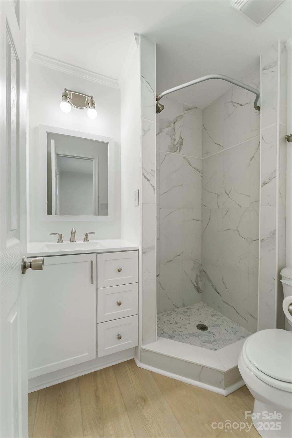 4146 Old State Road Newton, NC 28658 - Photo 13 of 26 a bathroom with a sink toilet and shower