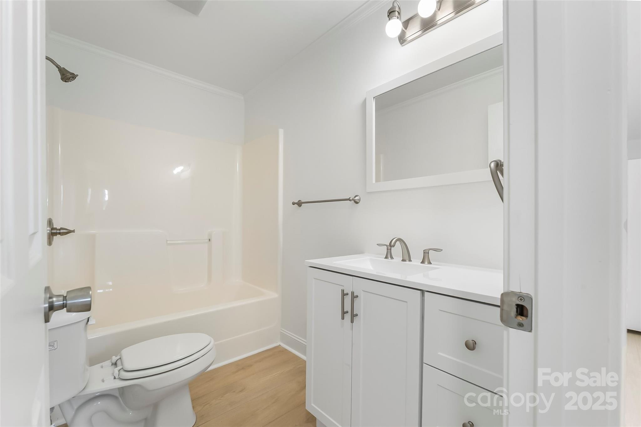 4146 Old State Road Newton, NC 28658 - Photo 15 of 26 a bathroom with a sink a toilet and shower