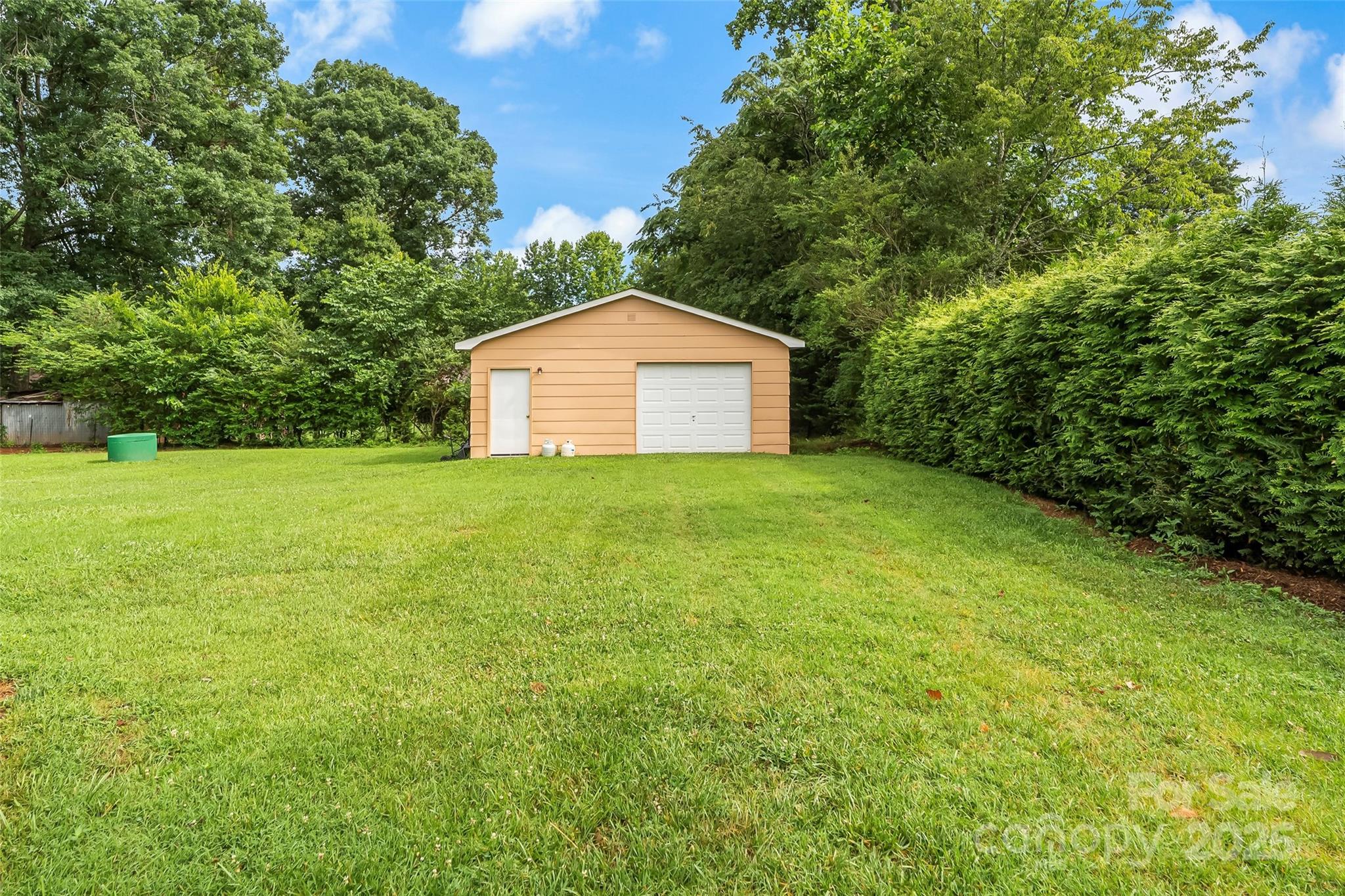 4146 Old State Road Newton, NC 28658 - Photo 17 of 26 a view of a house with a yard and garage