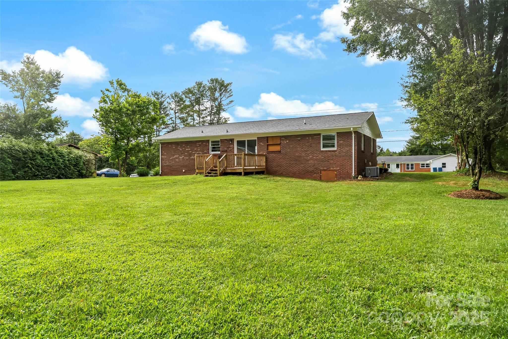 4146 Old State Road Newton, NC 28658 - Photo 21 of 26 a view of a house with yard and a garden