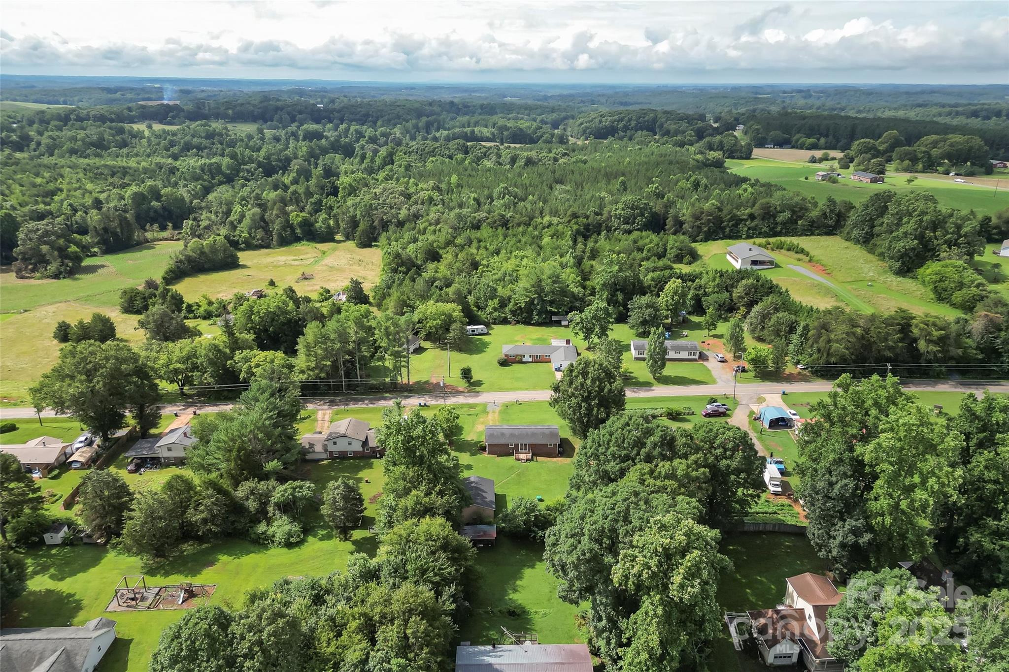 4146 Old State Road Newton, NC 28658 - Photo 24 of 26 an aerial view of residential houses with outdoor space and trees