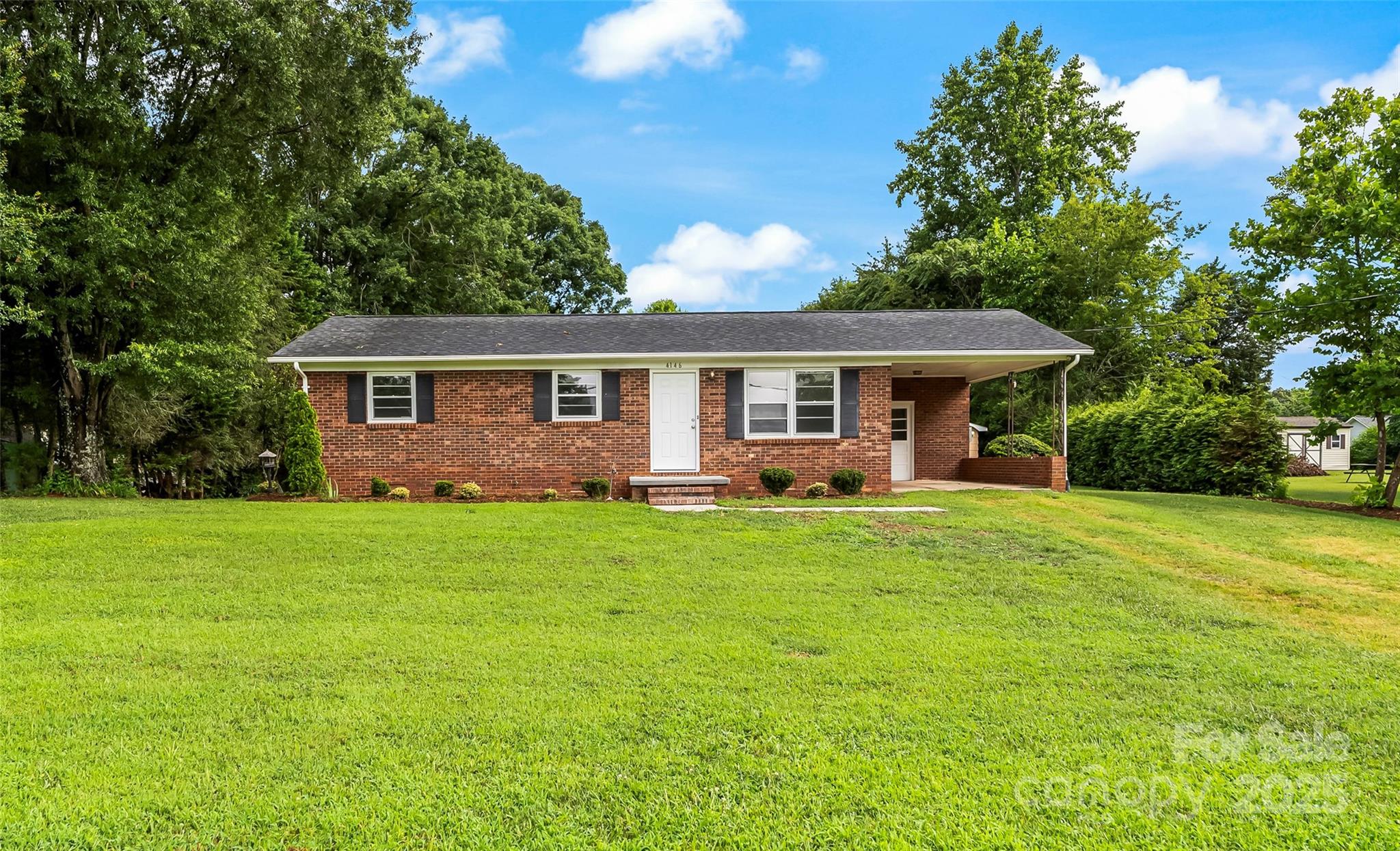 4146 Old State Road Newton, NC 28658 - Photo 25 of 26 a view of a house with a backyard