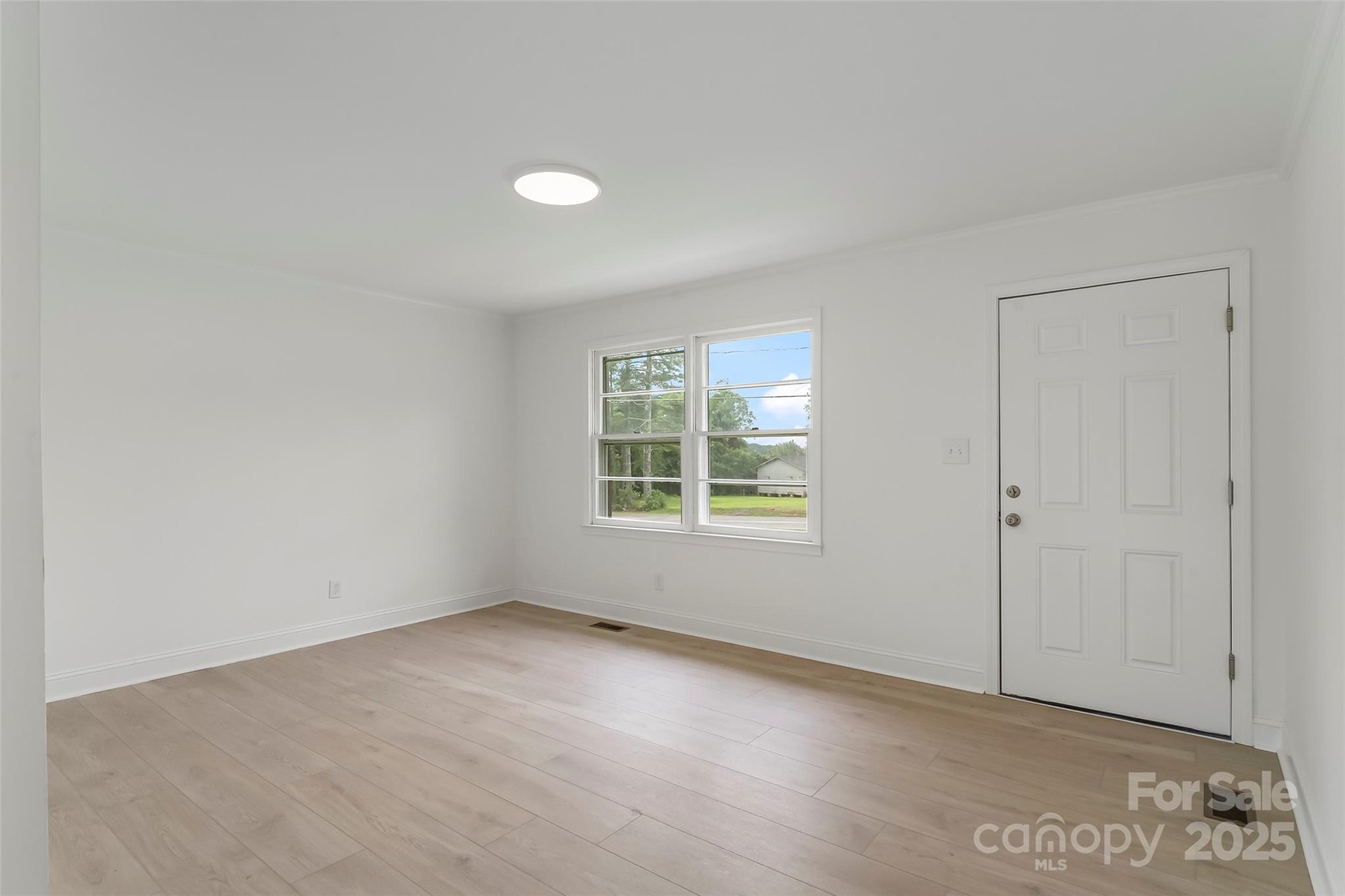 4146 Old State Road Newton, NC 28658 - Photo 4 of 26 an empty room with windows